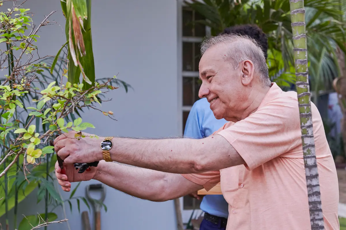Senior man gardening at Senior Circle assisted living, Clifton, Karachi