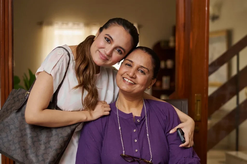 Daughter hugging her mother during a family visit at Senior Circle